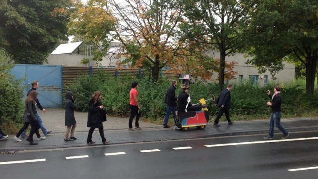 Tradition: supervisor carries his former PhD student in Doctor wagon. 